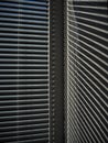 Blinds on the window and a pattern of shadow and light on the wall. Royalty Free Stock Photo