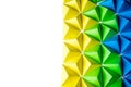 Abstract background with blue, green and yellow origami tetrahedrons