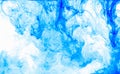 Abstract background. Blue ink in water, in motion. Color drop swirling. Colorful cloud of paint on white.