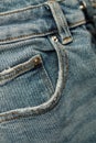 Abstract background with blue jeanse, close-up. Fashion details. Vertical photo Royalty Free Stock Photo