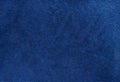 dark blue suede fabric closeup. Velvet matt texture of navy blue nubuck textile Royalty Free Stock Photo