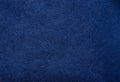 dark blue suede fabric closeup. Velvet matt texture of navy blue nubuck textile Royalty Free Stock Photo