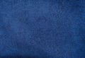 dark blue suede fabric closeup. Velvet matt texture of navy blue nubuck textile Royalty Free Stock Photo