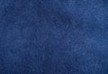 dark blue suede fabric closeup. Velvet matt texture of navy blue nubuck textile Royalty Free Stock Photo