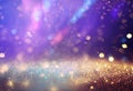 Glimmering Abstract Background: Silver, Purple, Blue, and Gold Sparkling Lights Royalty Free Stock Photo