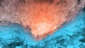 Abstract background, blue and orange layers of flakes, sky and earth, imitation of mountains or cave, warm-cold, natural Royalty Free Stock Photo