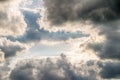 Abstract background, blue sky with dark cumulonimbus clouds.