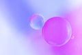 Abstract background in blue and violet soft tones. Macro drops of oil on the surface of the water. Delicate cosmetic Royalty Free Stock Photo
