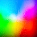 Abstract background. Abstract blur image of multicolored rainbow gradients and glare through frozen glass. The texture of water Royalty Free Stock Photo