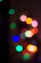 Abstract background with blurred multicolored lights garlands on a black background Royalty Free Stock Photo