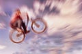 Abstract background. Boy on a BMX mountain bike jumping. Motion Royalty Free Stock Photo