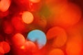 Abstract background of bright glittering lights, Christmas red blue yellow holiday bokeh Royalty Free Stock Photo