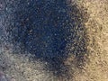 Abstract background with brown and gray asphalt and black spot of bitumen. Texture, frame, copy space and place for text Royalty Free Stock Photo