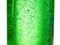 Abstract background : bubble of sparkling water soda on the green glass bottle with gradient light Royalty Free Stock Photo