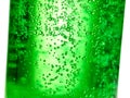 Abstract background : bubble of sparkling water soda on the green glass bottle with gradient light Royalty Free Stock Photo