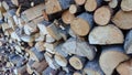 Abstract background with chopped wood in a large heap and stacked in storage piles