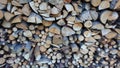 Abstract background with chopped wood in a large heap and stacked in storage piles