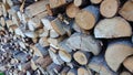 Abstract background with chopped wood in a large heap and stacked in storage piles