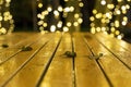 Abstract background of Christmas lights and wooden table Royalty Free Stock Photo