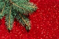 Abstract background Christmas tree on red blurred lights bokeh. New Year mood concept. Soft selective focus, defocus. Flat lay Royalty Free Stock Photo