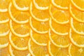Abstract background with citrus-fruit of orange slices. Close-up. orange cut into slices is lying on the table Royalty Free Stock Photo