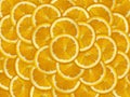 Abstract background with citrus-fruit of orange slices. Close-up. orange cut into slices is lying on the table. Royalty Free Stock Photo