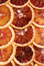 Abstract background with citrus fruit of orange slices. Pattern of orange red citruses. Close-up Royalty Free Stock Photo