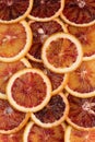 Abstract background with citrus fruit of orange slices. Pattern of orange red citruses. Close-up Royalty Free Stock Photo