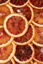 Abstract background with citrus fruit of orange slices. Pattern of orange red citruses. Close-up Royalty Free Stock Photo