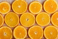 Abstract background with citrus orange slices on parchment paper. Close up. Top view. Studio photography