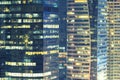 Abstract background from closeup of high modern building in business center at night. Business and finace background.