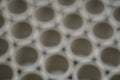 Abstract background. Cluster holes. Blurred cardboard sleeves. Defocused spools and bobbins for winding paper.