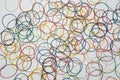 Abstract background with colored rubber bands for money on a white background