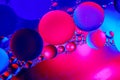 Abstract background with colorful gradient colors. Oil drops in water abstract psychedelic pattern image. Blue red colored Royalty Free Stock Photo