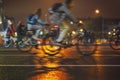 Abstract background of colorful group of bicyclists, night city street, blur effect, unrecognizable people. Sport Royalty Free Stock Photo