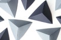 Abstract background with copy space and monochrome origami tetrahedrons Royalty Free Stock Photo