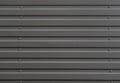 Abstract background corrugated gray metal for wall pattern, industrial. Gray city wall. Dark gray urban background. Copy space for Royalty Free Stock Photo