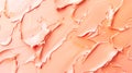 Abstract background of creamy peach-colored cosmetic foundation. Smooth texture with subtle variations in 13-1023 Peach Fuzz color