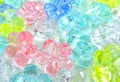 abstract background of decorative multicolor glass flowers , selective focus .