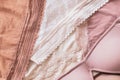 Abstract background of different lace panties in beige shades and bra