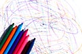 Abstract background. Doodles are drawn on a white background with a felt-tip pen. Bright felt-tip pens lie on the side. Royalty Free Stock Photo