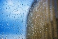 Abstract background. Drops of water on the window. High-rise buildings. Royalty Free Stock Photo