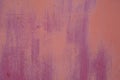 Faded from time and weather, painted in pink and maroon, metal surface with stripes from the brush. Royalty Free Stock Photo