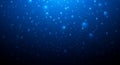 Abstract background of glowing blue bubbles and particles in deep dark water with light effects Royalty Free Stock Photo