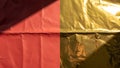 Crumpled red and gold foil texture background with light effect Royalty Free Stock Photo
