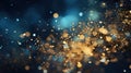 Abstract background featuring sparkling golden glitter over a dark blue bokeh effect, evoking a magical night sky. Royalty Free Stock Photo
