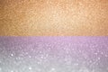 Abstract background filled with shiny gold and purple glitter Royalty Free Stock Photo