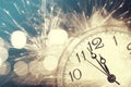 Abstract background with fireworks and clock close to midnight Royalty Free Stock Photo