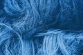 Abstract background with fishing net texture toned in blue monochrome Royalty Free Stock Photo