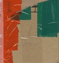 Abstract background. Fragment of brown cardboard transport packaging plastered with colored duct tape and polyethylene.